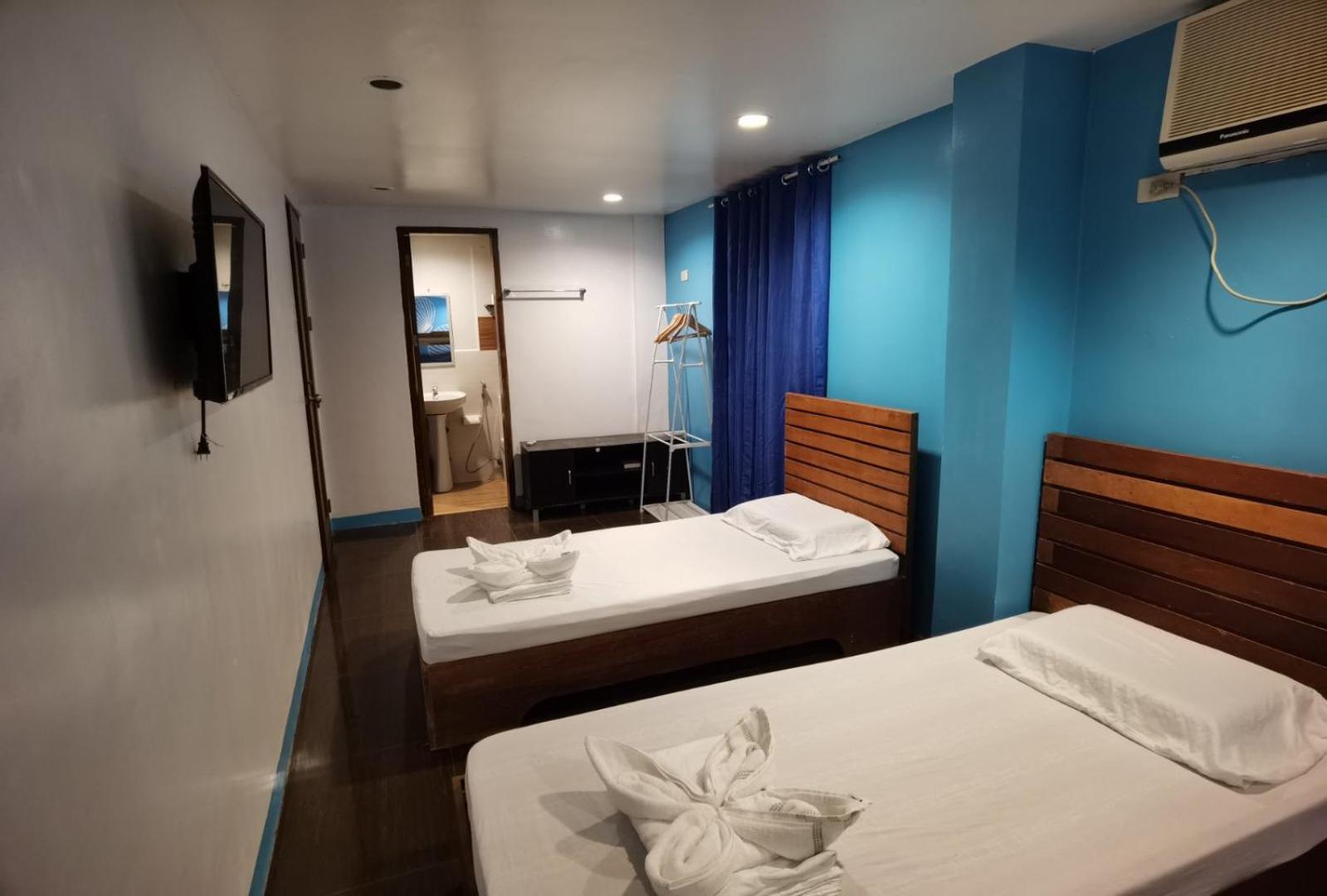 Amos Pili Tree Inn Powered By Cocotel إل نيدو الغرفة الصورة