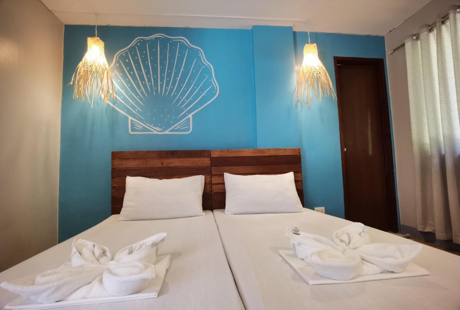 Amos Pili Tree Inn Powered By Cocotel إل نيدو الغرفة الصورة