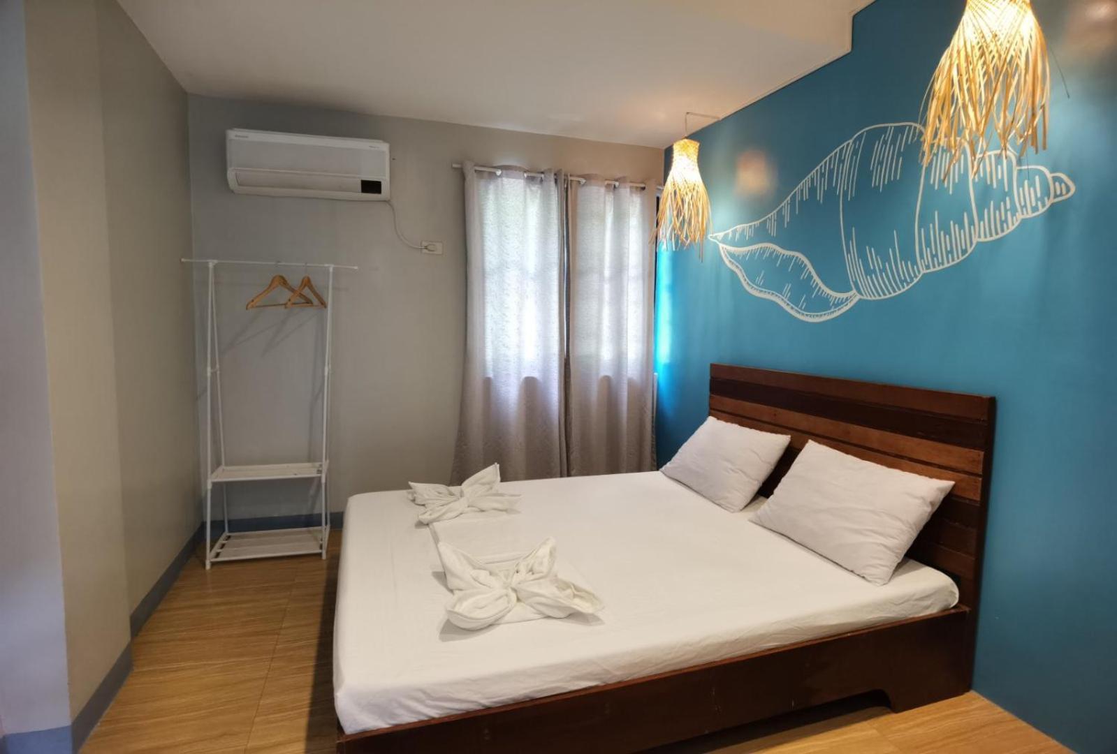 Amos Pili Tree Inn Powered By Cocotel إل نيدو الغرفة الصورة